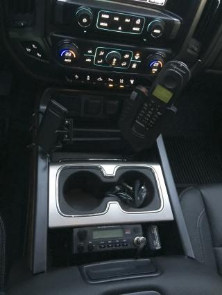 2016 GMC Sierra, Tad M10 in the center console pocket with a wilson booster cradle and Globalstar 1600 car kit.